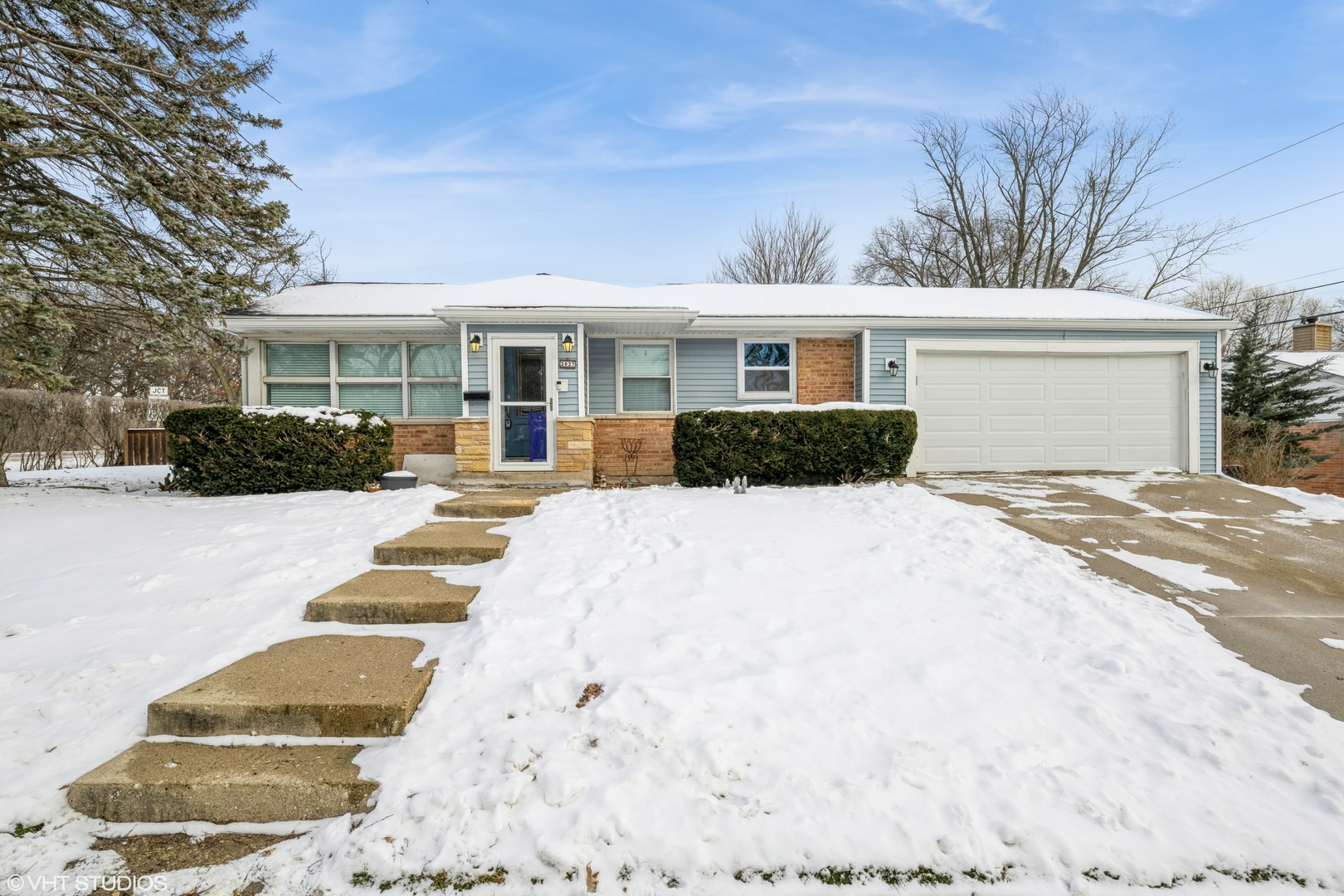 2027 Dundee Road Northbrook, IL 60062 - Photo 1 of 9 a view of a white house with a yard