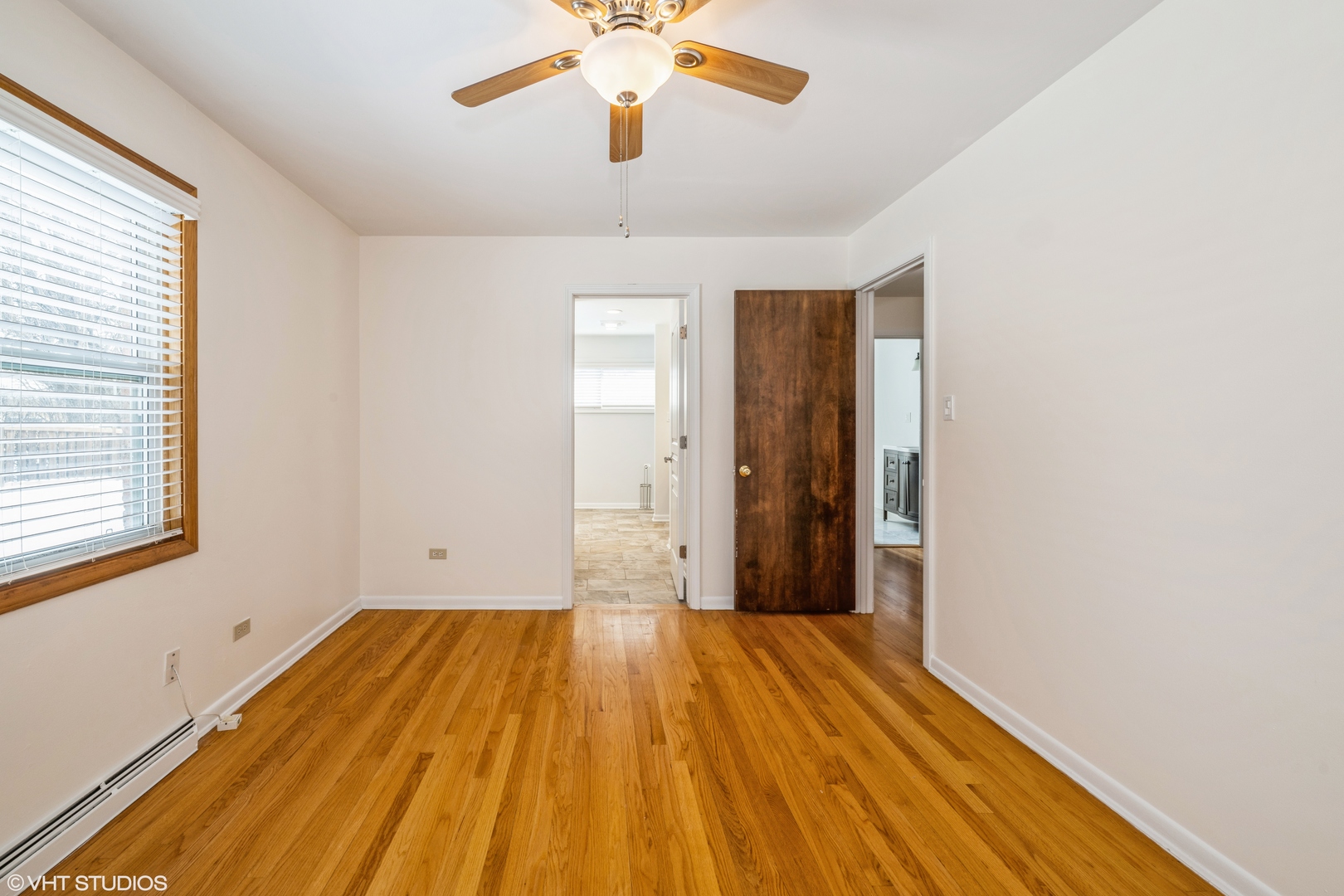 2027 Dundee Road Northbrook, IL 60062 - Photo 5 of 9 wooden floor in an empty room with a window