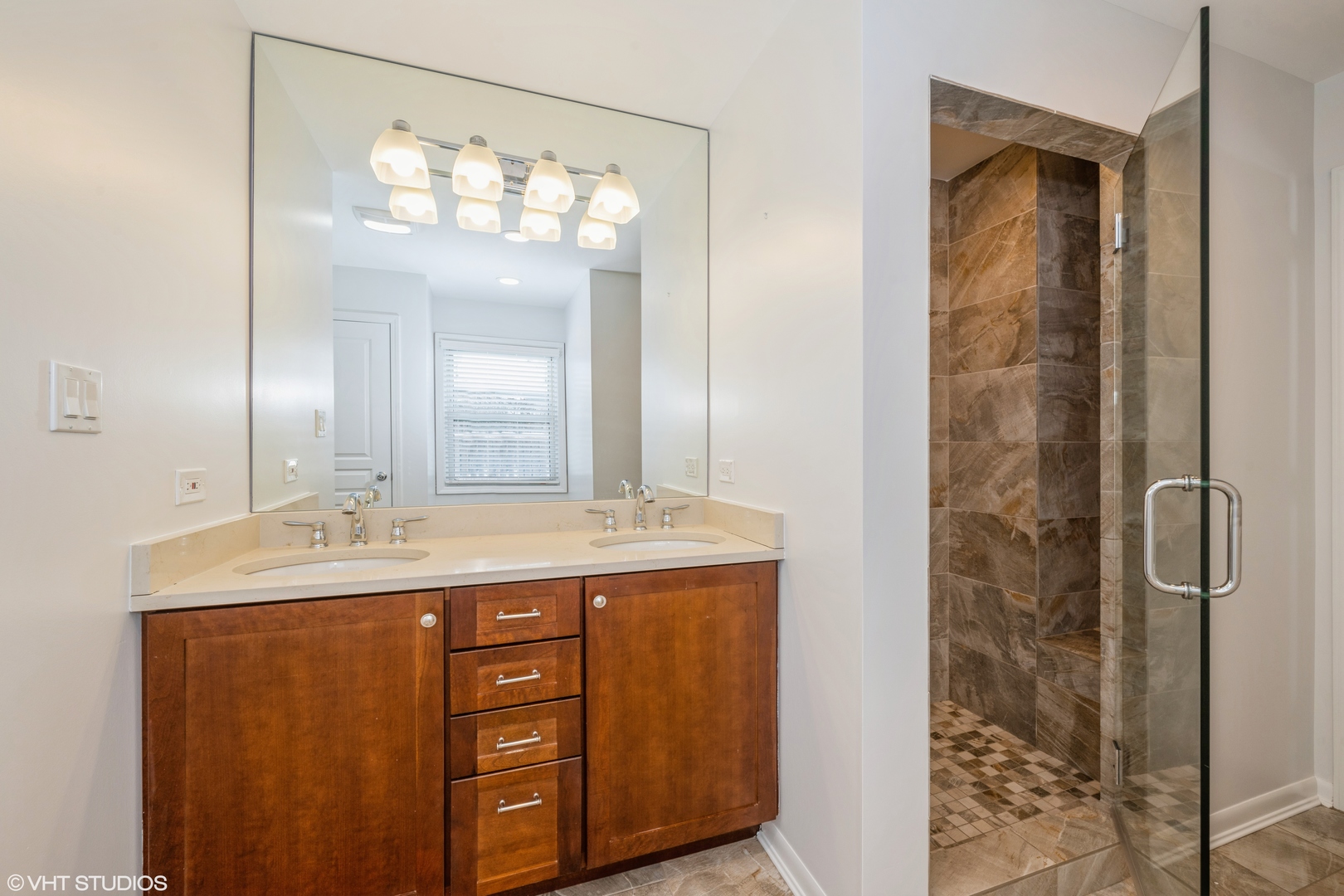 2027 Dundee Road Northbrook, IL 60062 - Photo 6 of 9 a bathroom with a double vanity sink and mirror