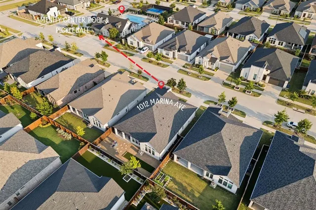 an aerial view of a backyard with seating space