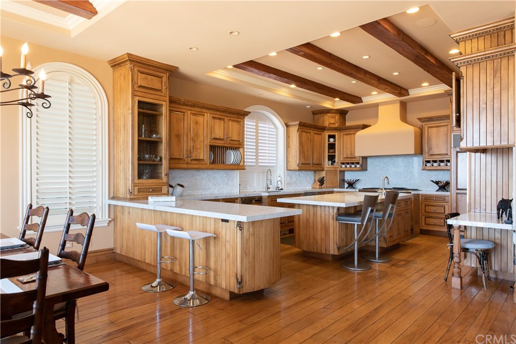 911 Kings Road Newport Beach, CA 92663 - Photo 12 of 47 a kitchen with a sink cabinets and wooden floor