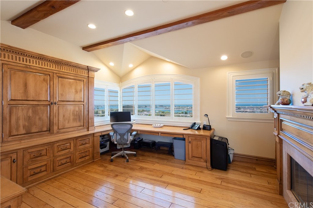 911 Kings Road Newport Beach, CA 92663 - Photo 16 of 47 a view of a workspace with furniture and a window