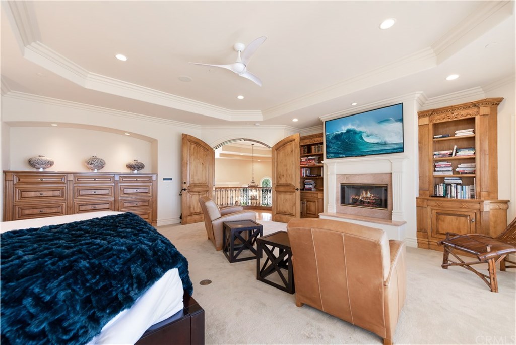 911 Kings Road Newport Beach, CA 92663 - Photo 23 of 47 a living room with furniture and a fireplace