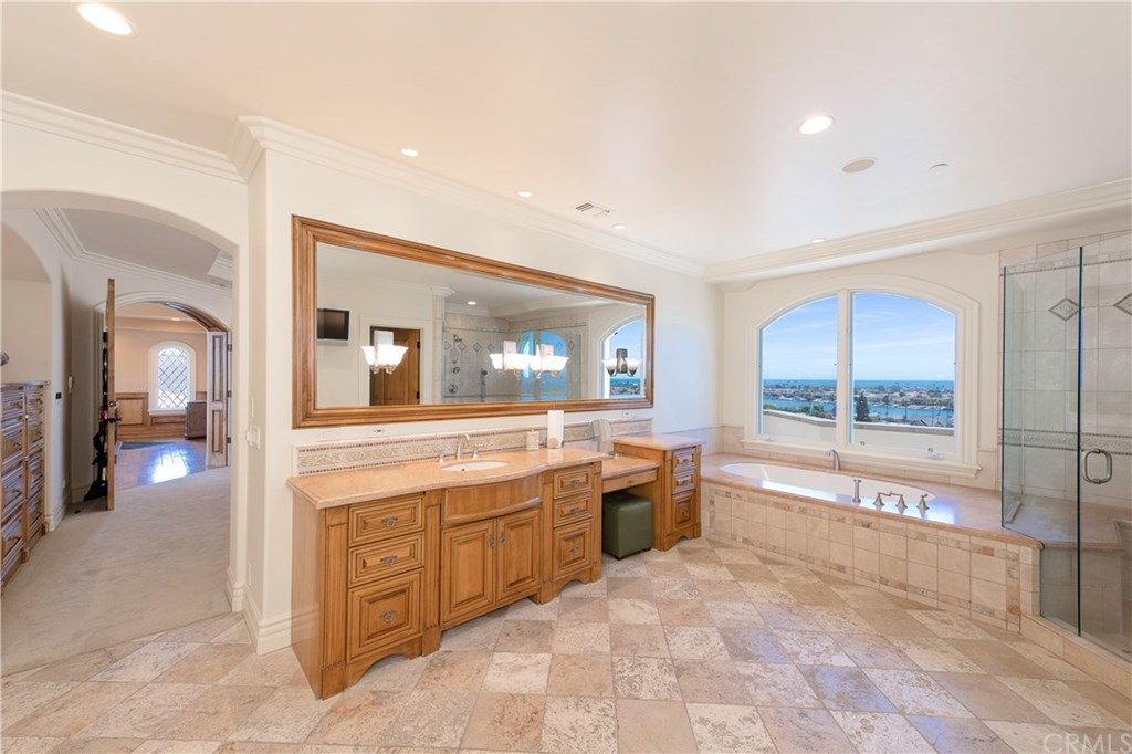 911 Kings Road Newport Beach, CA 92663 - Photo 24 of 47 a large bathroom with a large tub and shower