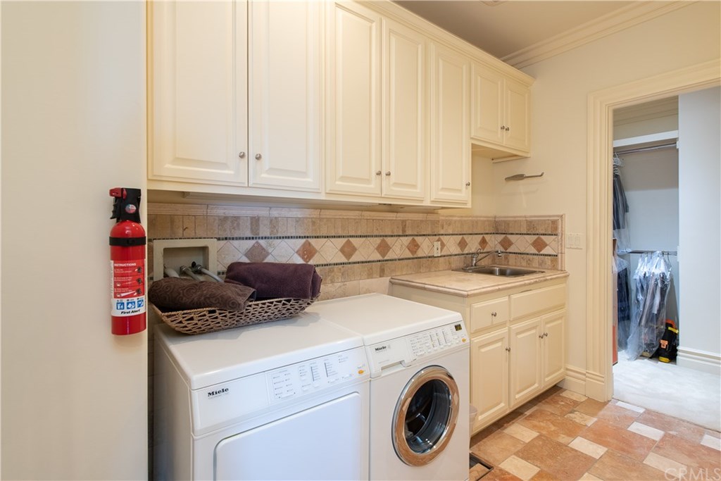 911 Kings Road Newport Beach, CA 92663 - Photo 29 of 47 a view of a kitchen with washer and dryer