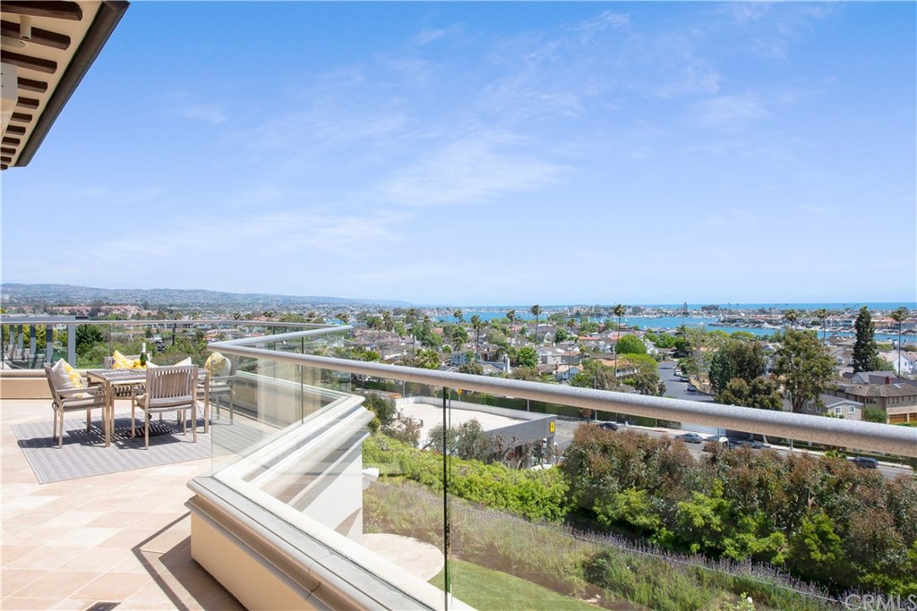 911 Kings Road Newport Beach, CA 92663 - Photo 3 of 47 a view of a city from a balcony with seating space