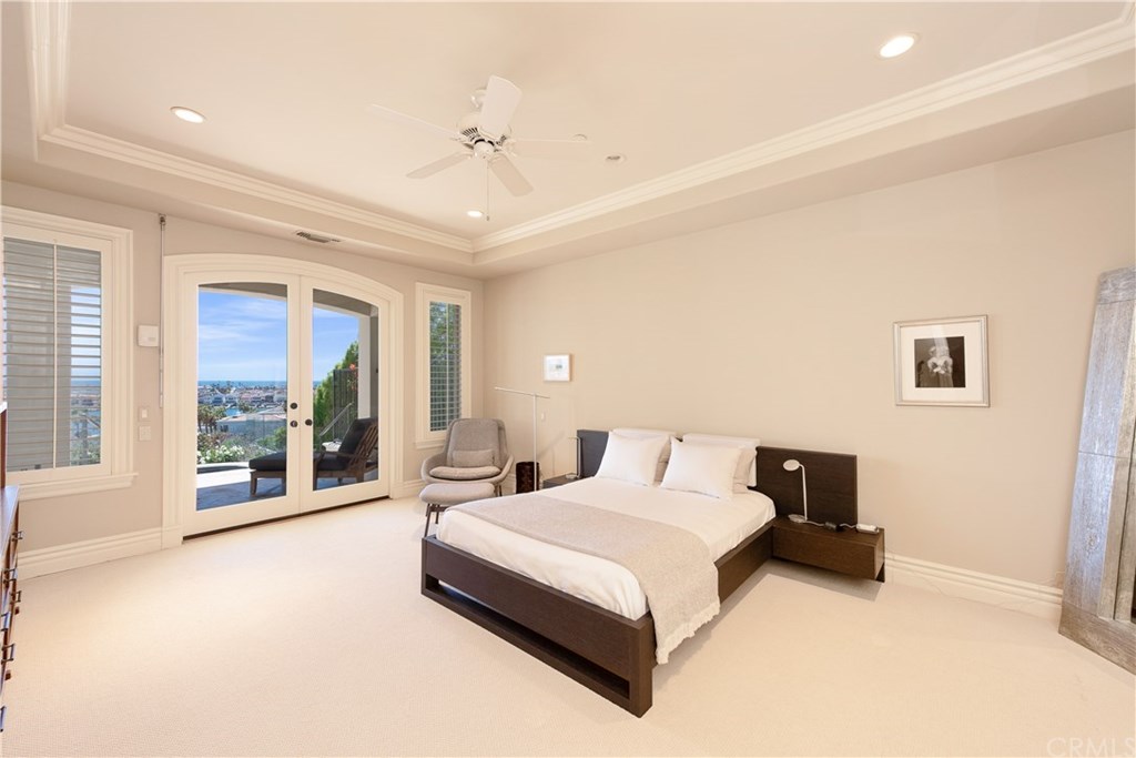 911 Kings Road Newport Beach, CA 92663 - Photo 36 of 47 a spacious bedroom with a large bed and a large window