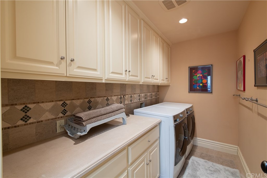 911 Kings Road Newport Beach, CA 92663 - Photo 38 of 47 a utility room with dryer and washer