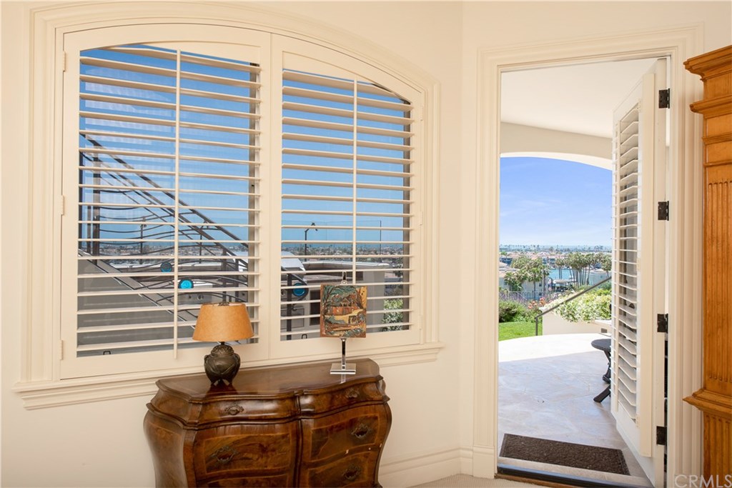 911 Kings Road Newport Beach, CA 92663 - Photo 40 of 47 a view of balcony with a potted plant and a window