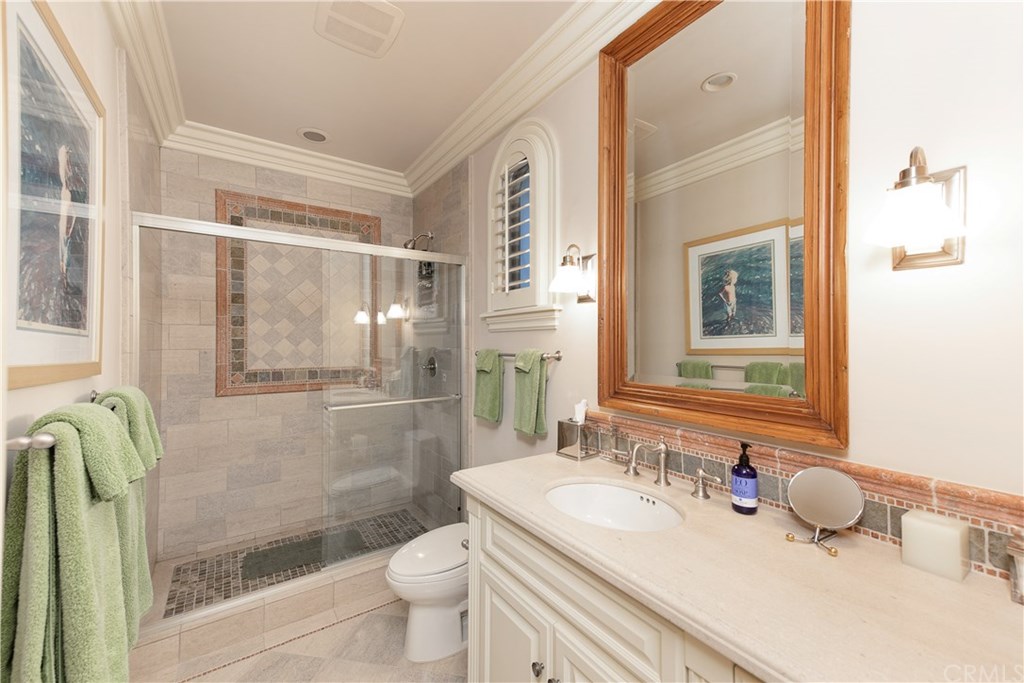 911 Kings Road Newport Beach, CA 92663 - Photo 42 of 47 a bathroom with a sink toilet and shower