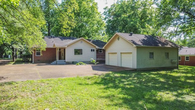 a house view with a garden space