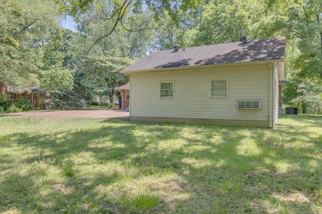 a backyard of a house with lots of green space