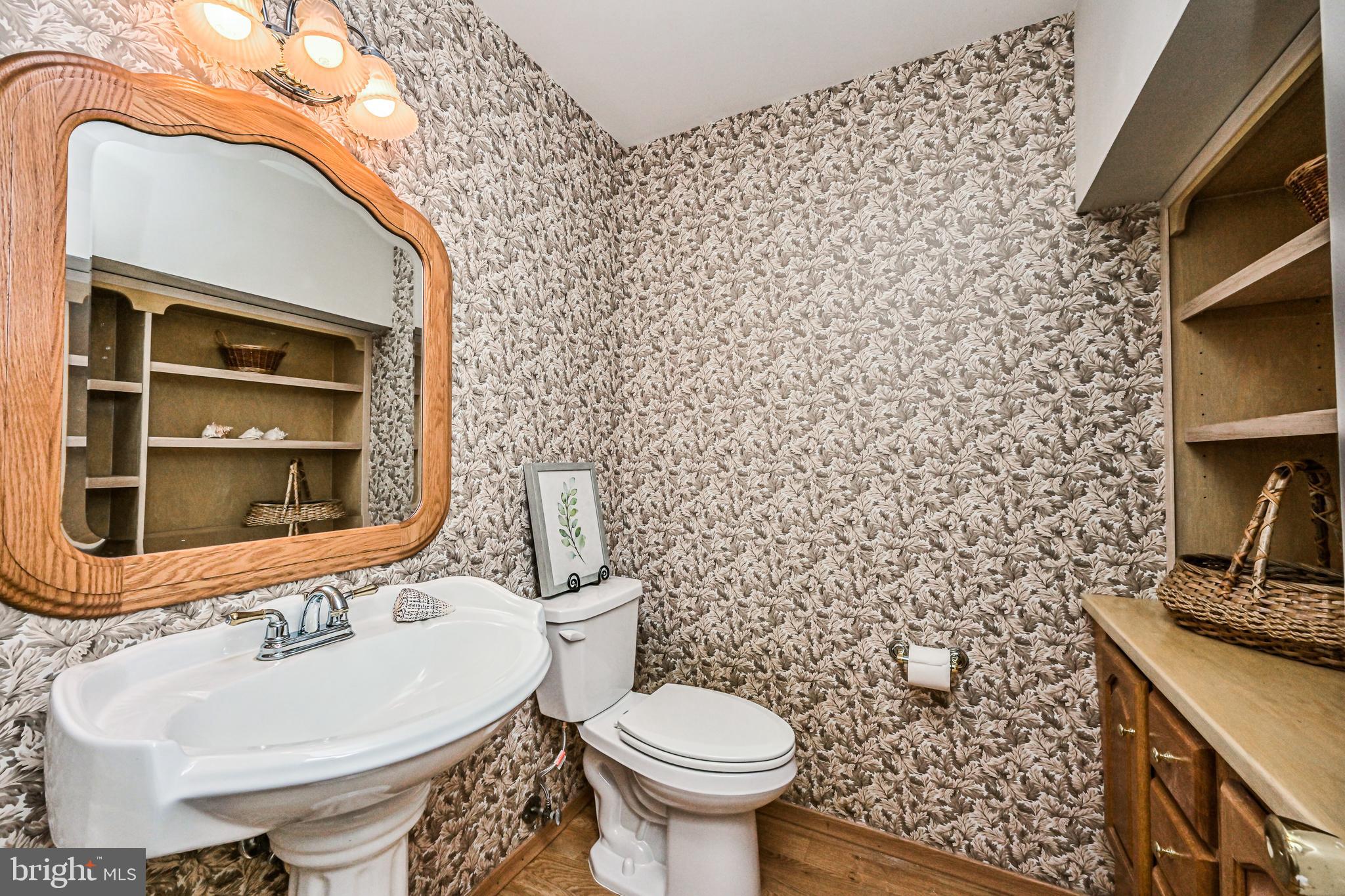 11730 Quay Road Oakton, VA 22124 - Photo 35 of 58 REMODELED POWDER RM OFF FAMILY ROOM