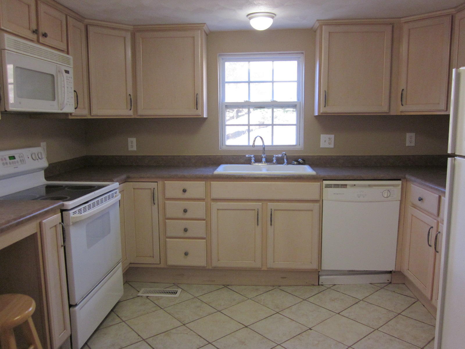 1885 Old Forge Road Callaway, VA 24067 - Photo 17 of 48 a kitchen with white cabinets sink and window