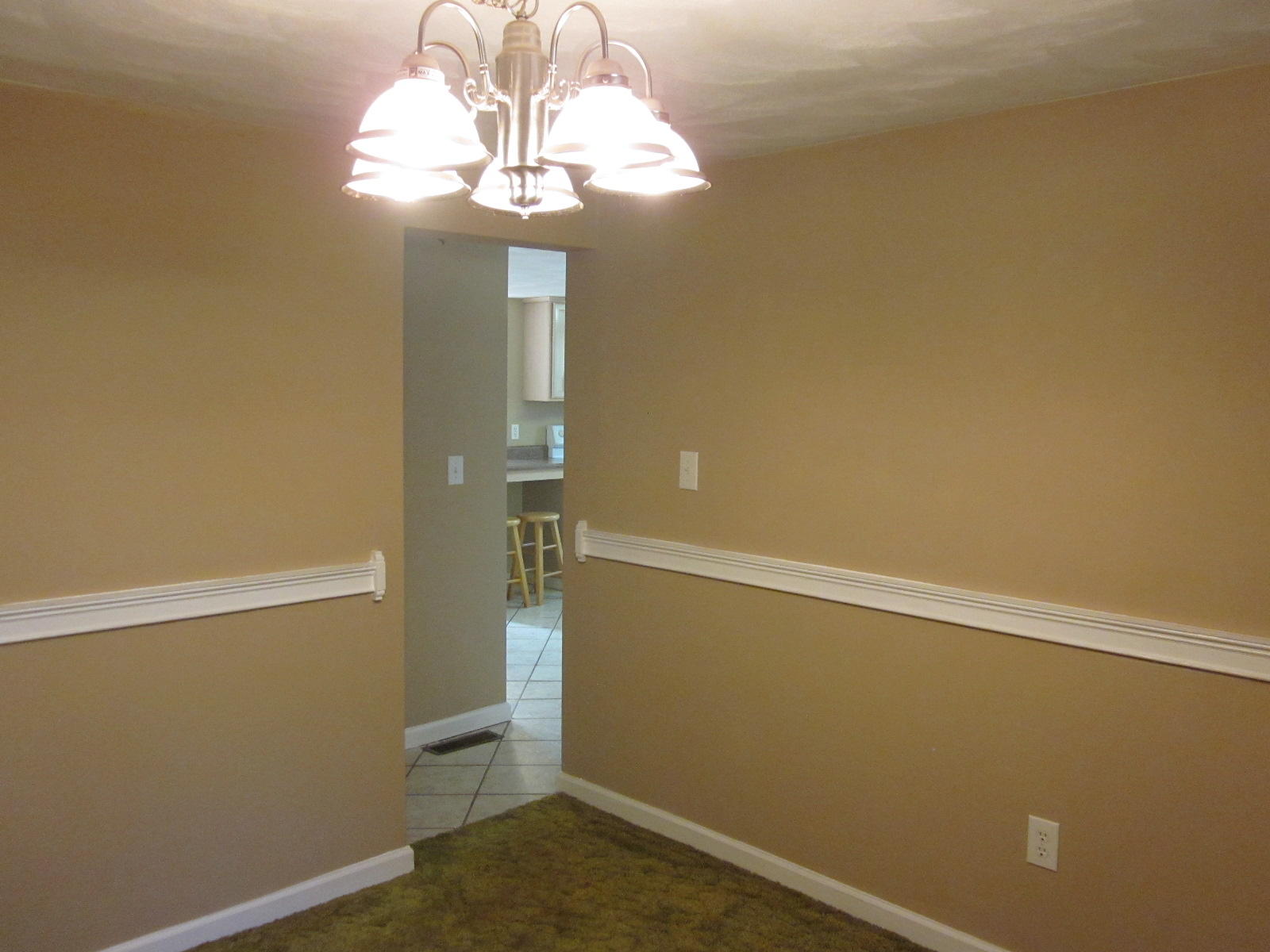 1885 Old Forge Road Callaway, VA 24067 - Photo 20 of 48 an empty room with a chandelier fan and wooden floor