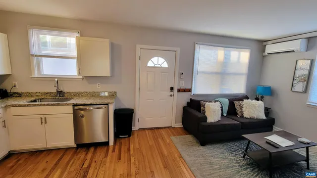 a living room with granite countertop furniture and a fireplace