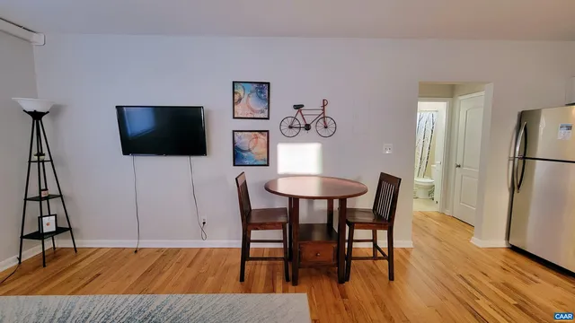 a view of a livingroom with furniture and a flat screen tv
