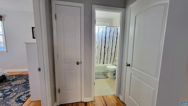 a view of a bathroom from a hallway