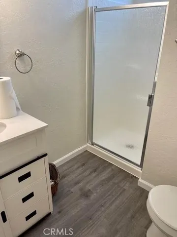 a view of bathroom with a toilet a sink and a mirror