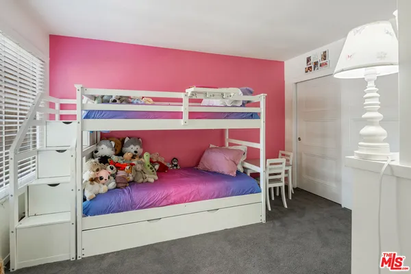 a bedroom with furniture and a bed