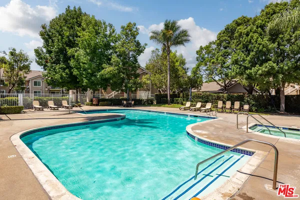 a view of a swimming pool with a patio