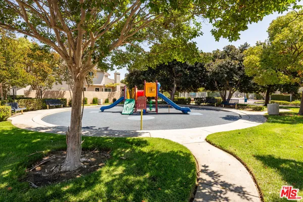 a park with lots of green space and trees