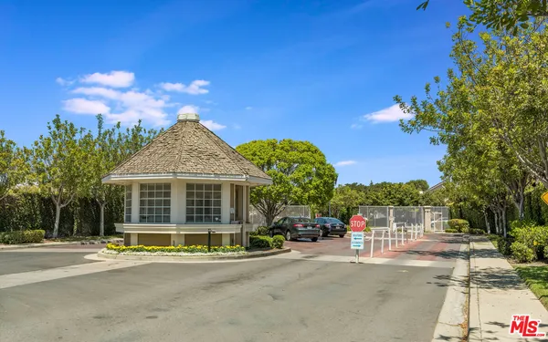 a view of a house with outdoor space and palm trees