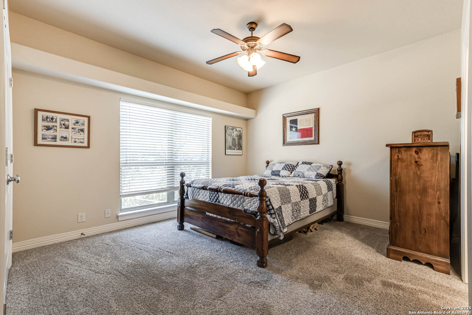 160 Gadwall Way Spring Branch, TX 78070 - Photo 15 of 45 a bedroom with a bed and a table