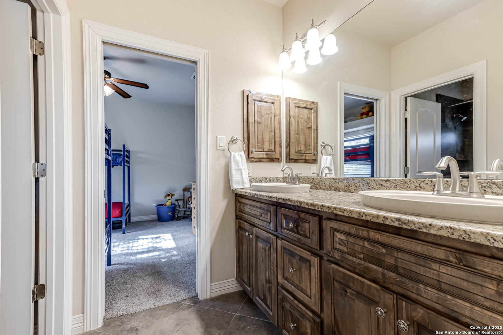 160 Gadwall Way Spring Branch, TX 78070 - Photo 16 of 45 a en suite bathroom with a double vanity sink and a mirror