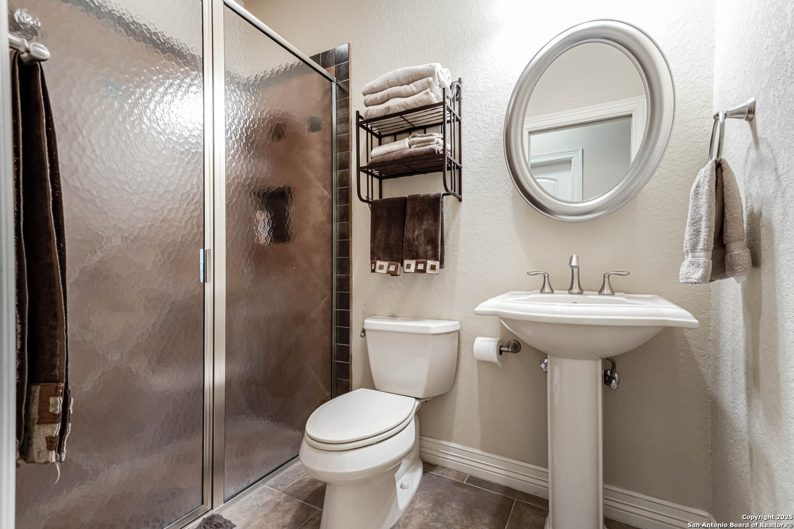 160 Gadwall Way Spring Branch, TX 78070 - Photo 20 of 45 a bathroom with a sink a toilet and a mirror
