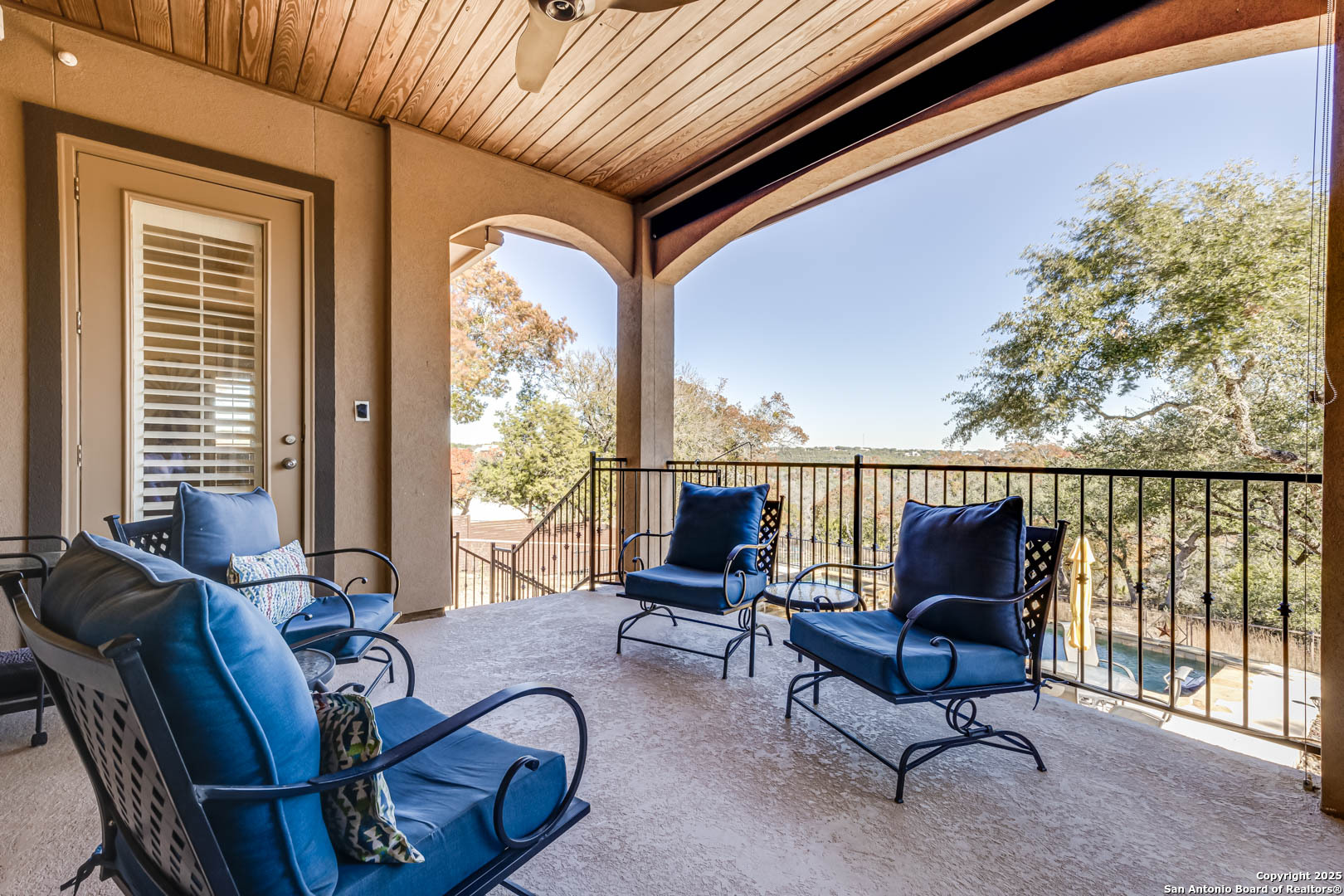 160 Gadwall Way Spring Branch, TX 78070 - Photo 24 of 45 a living room with furniture and floor to ceiling windows