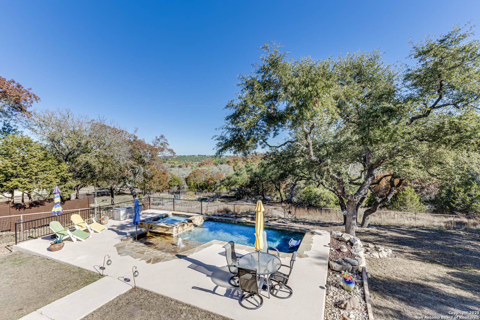 160 Gadwall Way Spring Branch, TX 78070 - Photo 28 of 45 a view of backyard with swimming pool and seating space