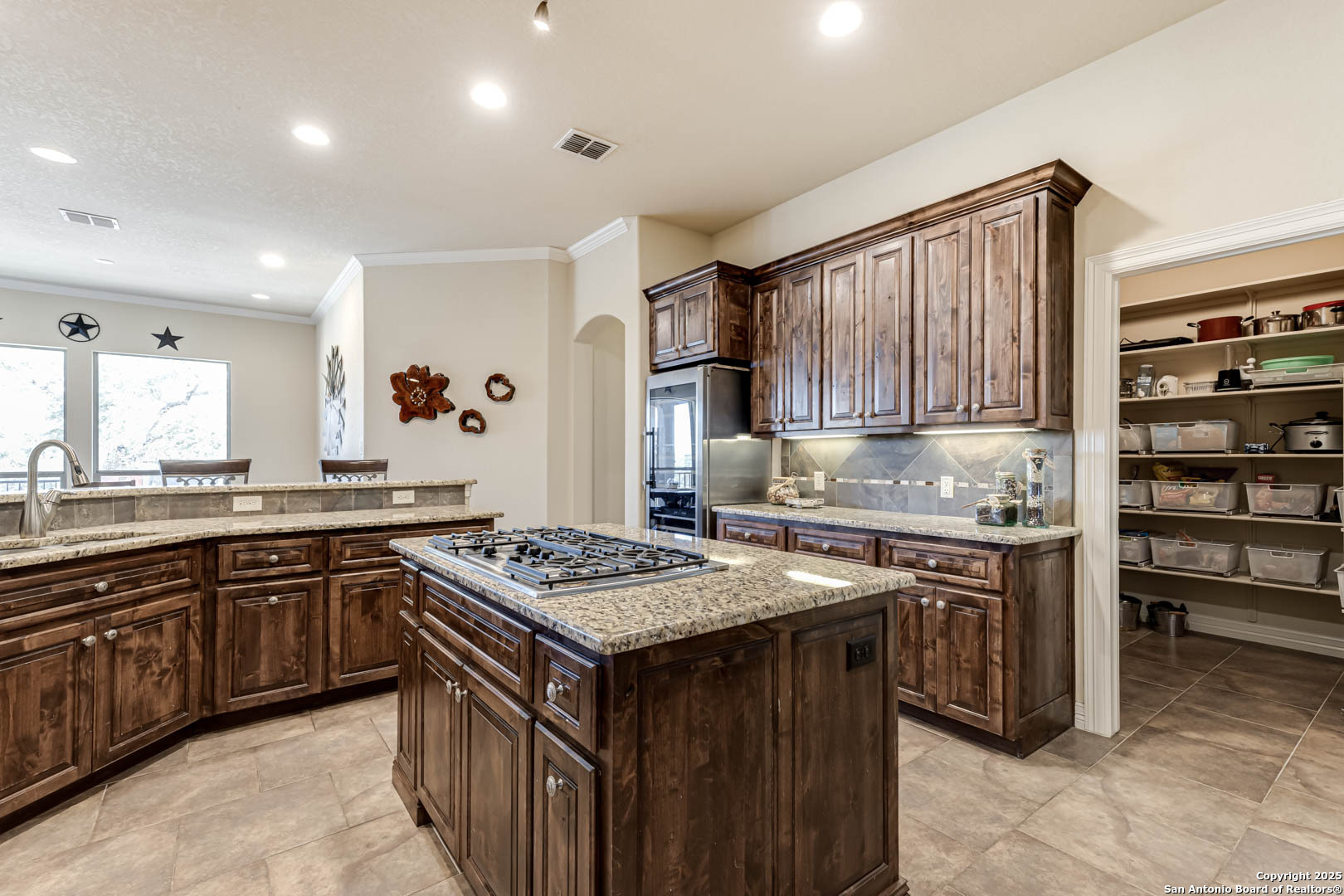 160 Gadwall Way Spring Branch, TX 78070 - Photo 3 of 45 a kitchen with stainless steel appliances granite countertop a stove a sink dishwasher and cabinets with wooden floor