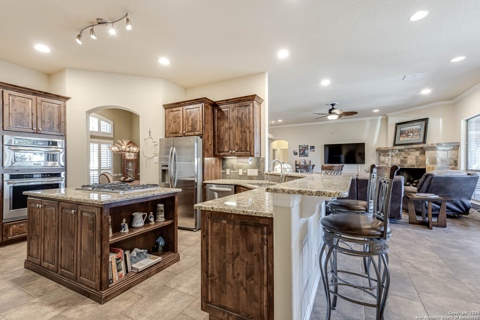 160 Gadwall Way Spring Branch, TX 78070 - Photo 4 of 45 a kitchen with stainless steel appliances granite countertop a stove oven and a refrigerator
