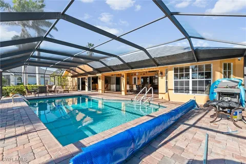 a view of a swimming pool with a patio