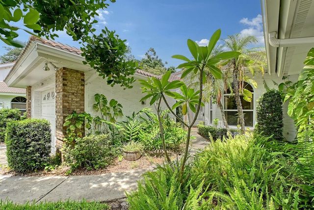 a plant that is in front of a house
