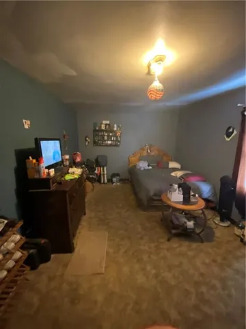 a room with furniture and gym equipment