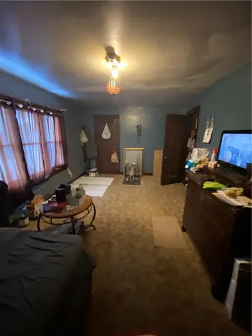 a room with furniture window and a flat screen tv