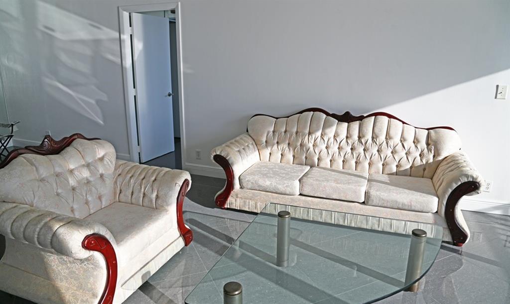 531 North Ocean Boulevard, Unit 1911 Pompano Beach, FL 33062 - Photo 11 of 34 a living room with furniture