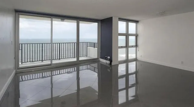 an empty room with a empty space and a window