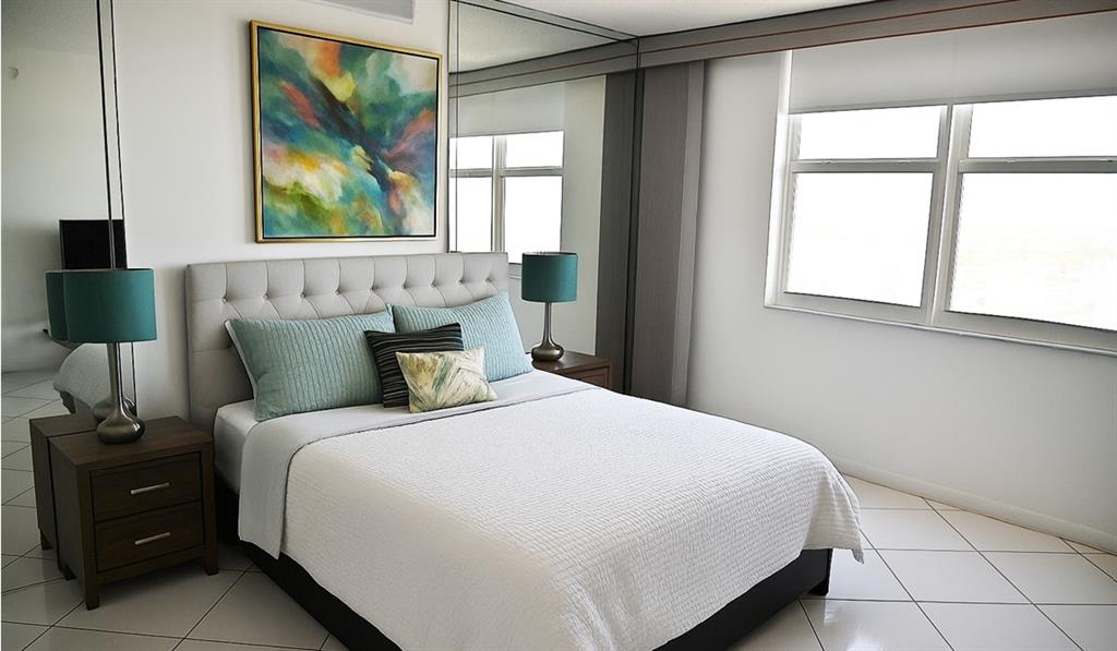 531 North Ocean Boulevard, Unit 1911 Pompano Beach, FL 33062 - Photo 16 of 34 a bedroom with a bed and a window