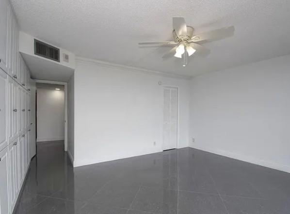 531 North Ocean Boulevard, Unit 1911 Pompano Beach, FL 33062 - Photo 27 of 34 wooden floor in an empty room with a window