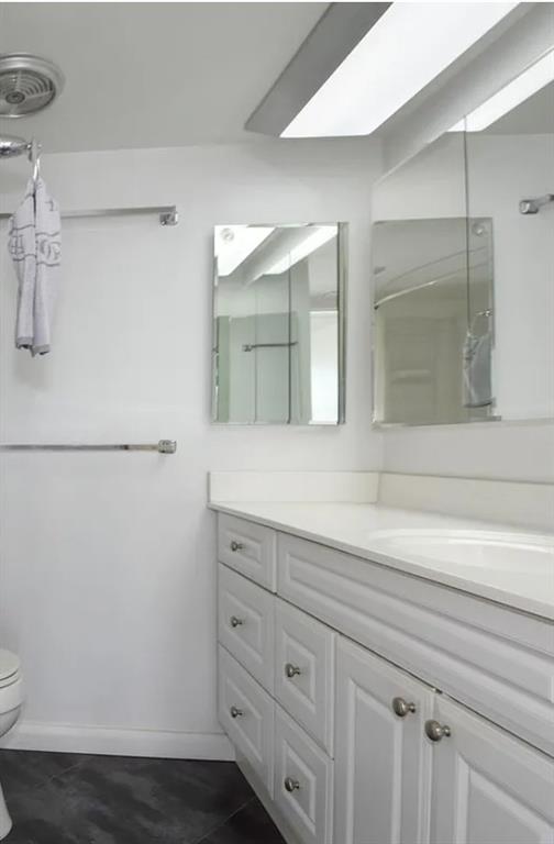 531 North Ocean Boulevard, Unit 1911 Pompano Beach, FL 33062 - Photo 28 of 34 a bathroom with a sink and a mirror