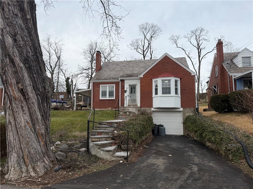 315 Caperton Street Pittsburgh, PA 15210 - Photo 1 of 16 a front view of a house with a yard