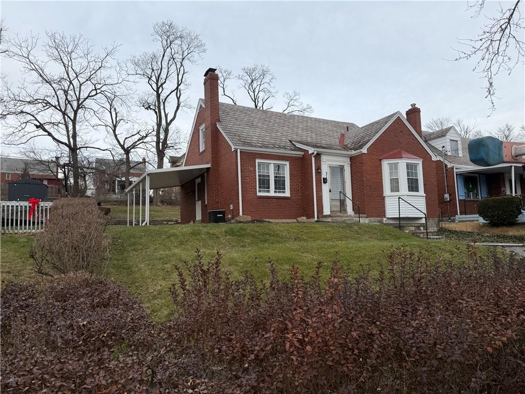 315 Caperton Street Pittsburgh, PA 15210 - Photo 2 of 16 a front view of a house with garden