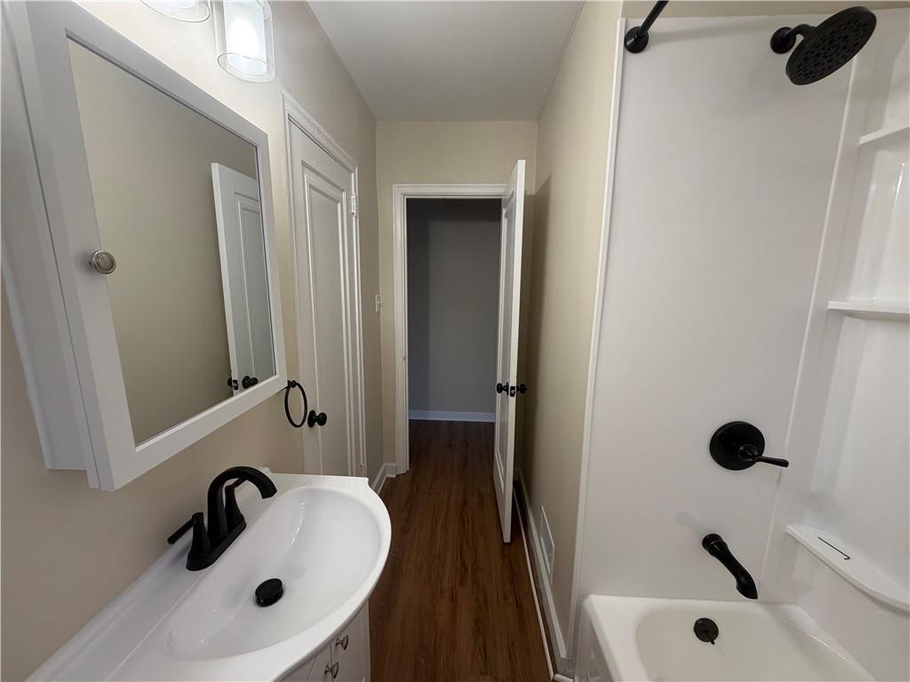 315 Caperton Street Pittsburgh, PA 15210 - Photo 5 of 16 a bathroom with a sink and a tub