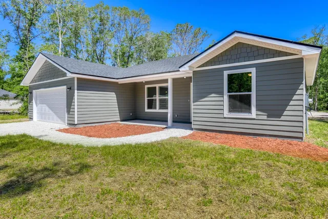 a front view of a house with yard