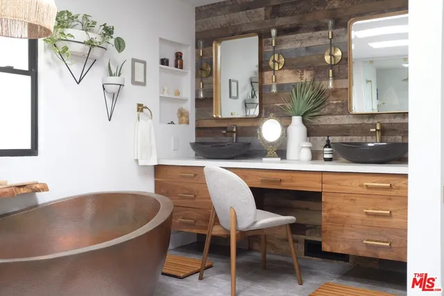 a bathroom with a sink a mirror and a bathtub