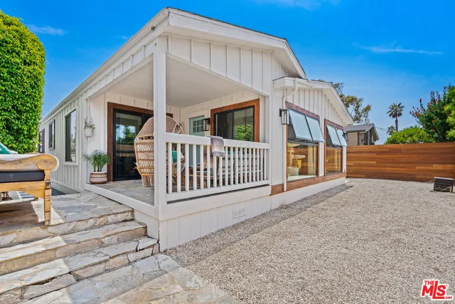 a view of a house with porch and wooden floor