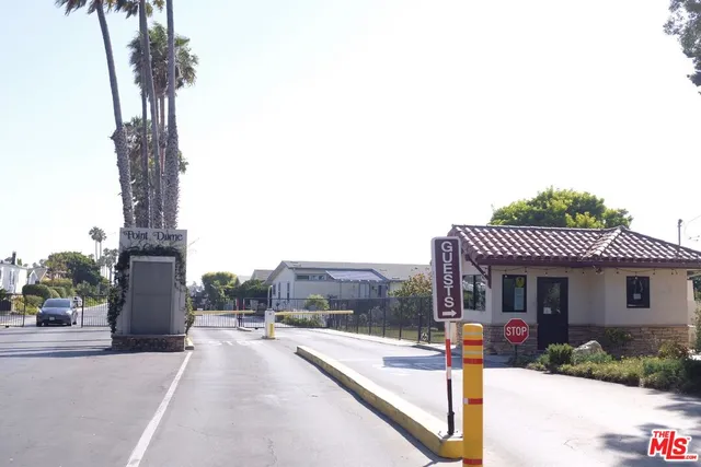 a front view of a house with a yard and table